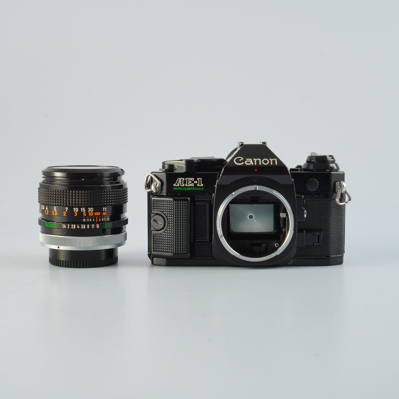 【SERVICED & TESTED】 Canon AE-1 Program Black + FD 50mm F/1.4 S.S.C. "O" MF フィルム一眼レフカメラ